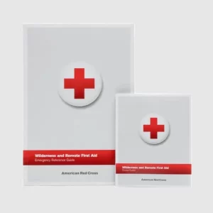 Person practicing first aid techniques on a hiking trail in the wilderness.